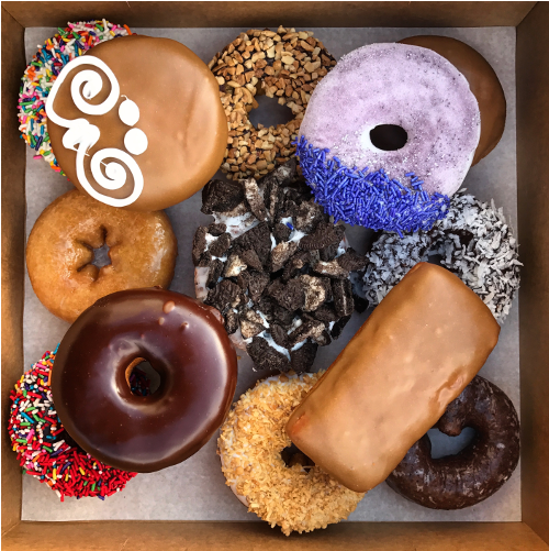 Vegan Voodoo Dozen Doughnuts Shown In A Box - Vegan Voodoo Dozen (500x750), Png Download
