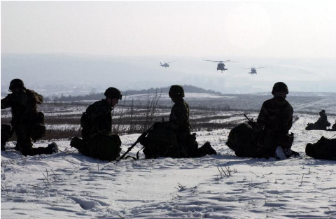 Soldiers Wait On The Snow Covered Ground As Uh-60 Blackhawks - Sea (958x450), Png Download