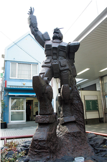 A Statue Of Gundam, A Popular Animation Hero, Was Erected - Kami Igusa Station Gundam Statue (480x320), Png Download