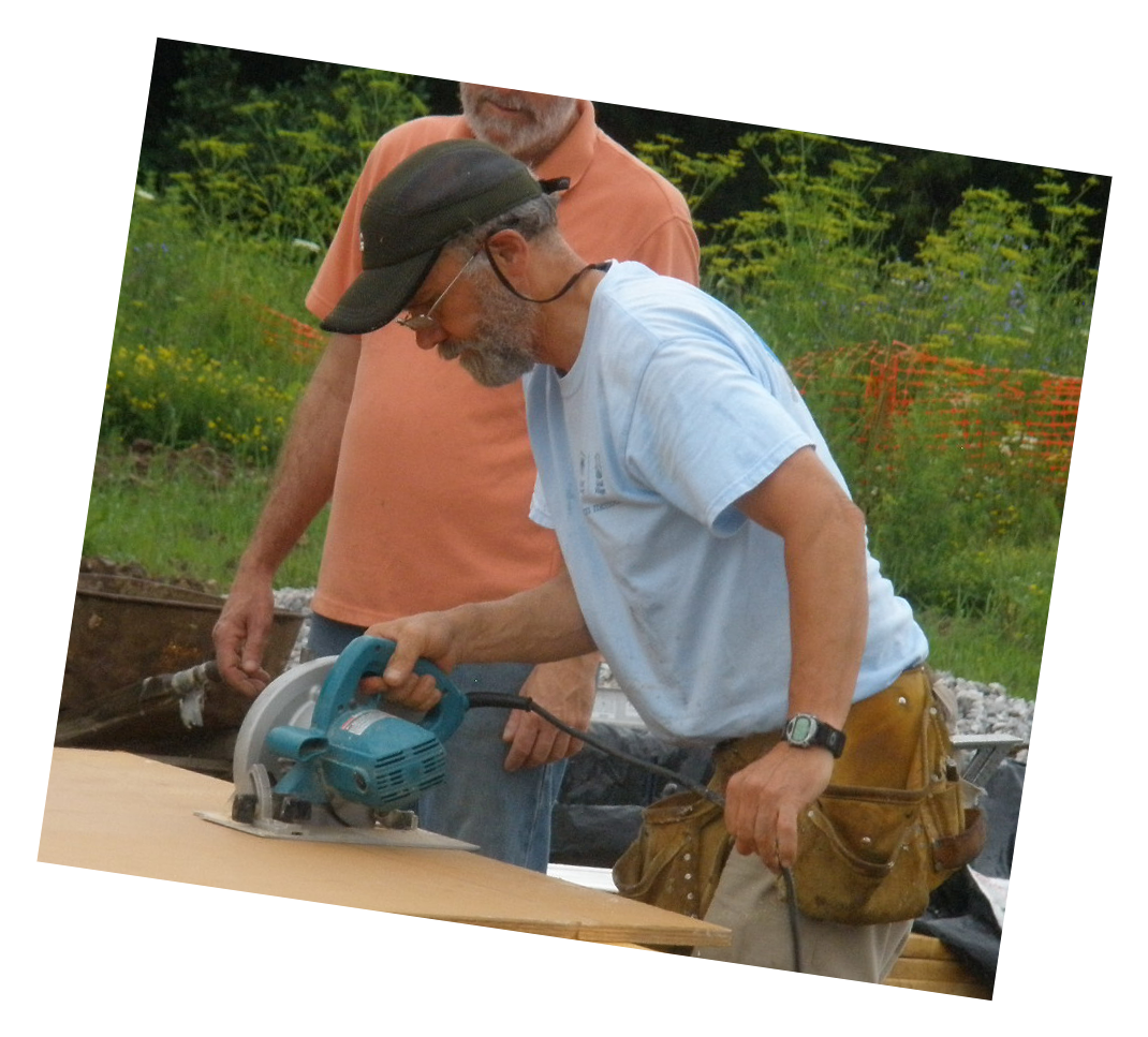 A Volunteer Uses A Circular Saw To Cut A Board On A - Backpack (1095x990), Png Download