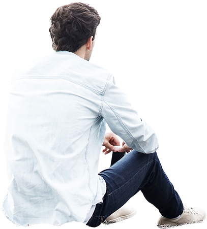 Man Sitting On The Ground And Holding His Cell Phone - People Sitting